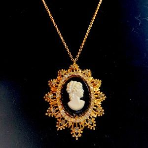 Vintage Gold Tone and Rhinestone broach/pendant on a 19” gold tone chain